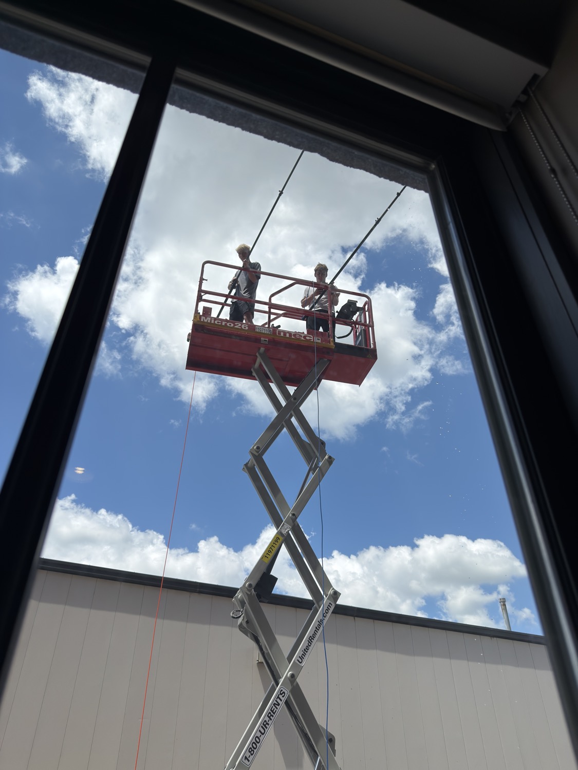 Commercial window cleaning from a scissor lift